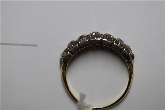 An early 20th century gold and graduated old cut diamond seven stone diamond half hoop ring, size M.